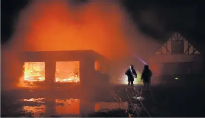  ?? PHOTO: STEPHEN JAQUIERY ?? Red dawn . . . Seven fire crews from around Dunedin battled to extinguish a blaze at a home on Seal Point Rd on the Otago Peninsula about an hour before dawn yesterday.