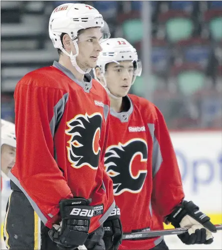  ?? LEAH HENNEL/POSTMEDIA NEWS ?? Calgary Flames Sean Monahan, left, and Johnny Gaudreau were on the ice at the Saddledome Wednesday after sitting out a game for being late to practice Monday.