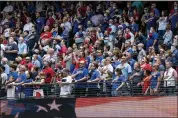  ?? JEFFREY MCWHORTER — THE ASSOCIATED PRESS ?? Fans stand for the national anthem before a baseball game between the Texas Rangers and the Toronto Blue Jays on Monday in Arlington, Texas.