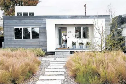  ?? Photos by Allen J. Schaben Los Angeles Times ?? OWNERS Gerun Riley and Jason Wilborn remade their Culver City abode with her architect brother Noah Riley leading the work.