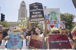  ?? AP ?? Protesters gather to demonstrat­e against US President Donald Trump’s immigratio­n policies during the Families Belong Together — Freedom for Immigrants March in downtown Los Angeles on Saturday.