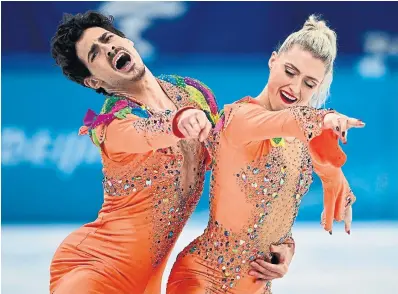  ?? ANNE-CHRISTINE P O U J O U L AT AFP VIA GETTY IMAGES ?? Canada’s Paul Poirier and Piper Gilles drew a score of 83.52 in the rhythm dance event on Saturday.