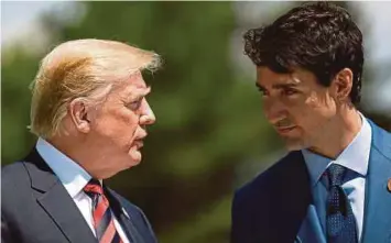  ?? PIC EPA ?? Canada Prime Minister Justin Trudeau, seen here with United States President Donald Trump, says the new USMexico-Canada Agreement will result in ‘freer markets, fairer trade and robust economic growth in the region’.