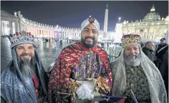  ?? REUTERS ?? Men dressed as the Three Wise Men wait in line at St Peter’s Basilica at the Vatican on Christmas Eve.