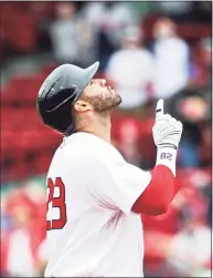  ?? Kathryn Riley / Getty Images ?? The Red Sox’s J.D. Martinez reacts after hitting a two-run double in the fifth inning against the Rays on Wednesday at Fenway Park.