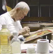  ??  ?? Malang at work in his studio in Quezon City. Malang was known to paint everywhere – even on table napkins. The world, it was said, was his studio.