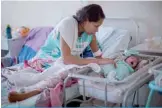  ?? —AFP ?? BOA VISTA, RORAIMA, Brazil: In this file photo Venezuelan refugee Dayana Rodriguez, 17, takes care of her newborn daughter Sofia, 12 days, at the Maternity Hospital Nossa Senhora de Nazare in the city of Boa Vista.