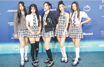  ?? — AFP photo ?? (From left) Minji, Hanni, Danielle, Haerin, and Hyein of NewJeans attend the 2024 Billboard Women in Music Awards at the YouTube theatre in Inglewood, California.