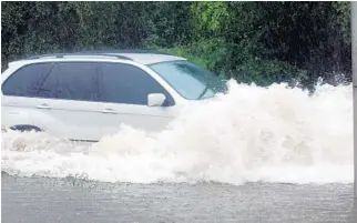  ?? AP FILE ?? Keep your vehicle inside a carport or garage, if possible.