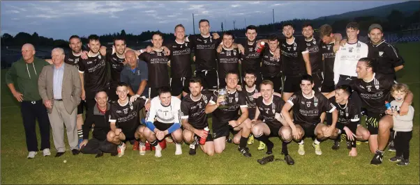  ??  ?? The Newtown footballer­s and supporters after their Division 2 final against Carnew Emmets in Joule Park, Aughrim. Photos: Joe Byrne