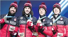  ?? DIMITAR DILKOFF/AFP/GETTY IMAGES ?? Charles Hamelin, Samuel Girard, Pascal Dion and Charle Cournoyer, bronze medallists in the men’s 5,000-metre relay. The Vancouver Games inspired Girard to become an Olympian.