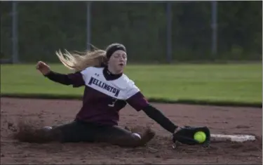  ?? JEN FORBUS — THE MORNING JOURNAL ?? Wellington short stop Allissa Boraggina gets down in the mud to stop the ball in the Dukes’ district semifinal game against the CVCA Royals on May 15.