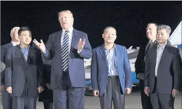  ?? SUSANWALSH — THE ASSOCIATED PRESS ?? President Donald Trump speaks at Andrews Air Force Base inMaryland as he stands with Tony Kim, left, KimDong Chul, center right, and Kim Hak Song, right, three Americans who were detained in North Korea for more than a year.
