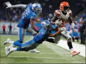  ?? AP PHOTO/RICK OSENTOSKI ?? Detroit Lions defensive back Mike Ford (38) helps push Cleveland Browns running back Dontrell Hilliard (25) out of bounds during the second half of an NFL pre-season game, Thursday in Detroit.