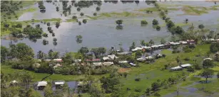  ?? (John Vizcaino/Reuters) ?? An aerial view of a flooded area in the municipali­ty of San Marcos in Sucre province May 20, 2011. Downpours due to La Nina have rocked the Andean nation since last year, displacing 3.8 million people and killing almost 450, authoritie­s said.