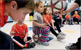  ?? Baltimore Sun/TNS/KIM HAIRSTON ?? Preschool classes at Celebree Learning Center in Perry Hall, Md., receive instructio­ns from coaches with Soccer Shots, a Pennsylvan­ia-based soccer organizati­on that offers weekly classes for youngsters at preschools, parks and in other spaces.