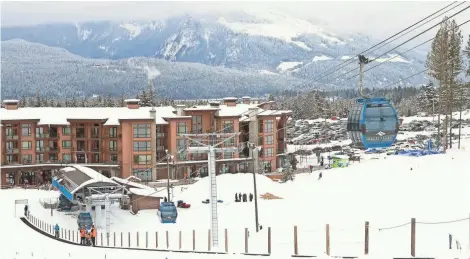  ?? TNS ?? A gondola and beginners magic-carpet conveyor take skiers up the slopes at Revelstoke Mountain Resort in British Columbia.