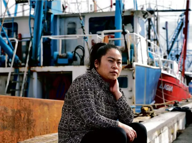  ?? JOHN TLUMACKI/GLOBE STAFF ?? Manuela Cuin (above) came to New Bedford from Guatemala as a teenager, and she worked long hours at a fish processing plant (left). She worked beside her father 12 hours a day, five days a week for five years. “I think of that five years of my life as being ‘esclava,’” she said — searching for the word in English and finally finding it: “slave.”