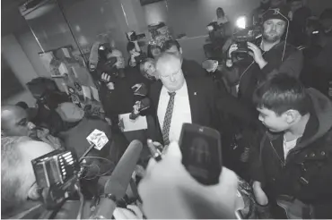  ?? MARK BLINCH/ THE CANADIAN PRESS ?? Toronto Mayor Rob Ford arrives at city hall Friday as he clears a path for schoolchil­dren into his office.