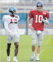  ?? JULIO CORTEZ THE ASSOCIATED PRESS ?? The New York Giants’ Odell Beckham, left, and quarterbac­k Eli Manning are rebuilding their timing after Beckham got hurt last season.