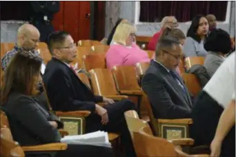  ?? PHOTOS BY JOHN BERRY — THE TRENTONIAN ?? Dr. Shing-Fu Hsueh, Acting Director, Department of Water and Sewer/Trenton Water Works, left, and Acting Fire Director Derrick Sawyer, right, await the advice and consent portion of Thursday’s Trenton City Council meeting.