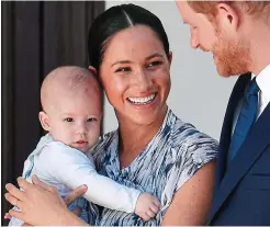  ?? ?? Dilemma: The proud parents with son Archie as a baby