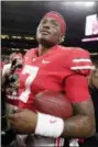  ?? MICHAEL CONROY — THE ASSOCIATED PRESS ?? Ohio State quarterbac­k Dwayne Haskins (7) celebrates after defeating Northweste­rn 45-24 in the Big Ten championsh­ip, Saturday in Indianapol­is.