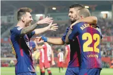  ?? — Reuters ?? Barcelona’s Aleix Vidal, Luis Suarez and Lionel Messi celebrate their second goal scored by Girona’s Gorka Iraizoz.