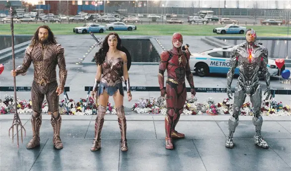  ?? WARNER BROS. ?? Jason Momoa, left, as Aquaman, Gal Gadot as Wonder Woman, Ezra Miller as The Flash and Ray Fisher as Cyborg prepare for a Justice League battle.