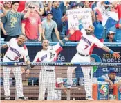  ?? EL NUEVO HERALD/COURTESY ?? The Dominican Republic players have a ball in the dugout during the 2013 world games in Miami.