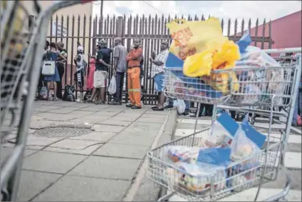  ??  ?? Food safety in focus: Customers queue to return Enterprise products in Germiston, outside Johannesbu­rg, after Tiger Brands ordered a recall. Photos: Oupa Nkosi