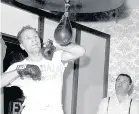  ??  ?? Below: Henry Cooper training in 1963 and West Ham stars using dumbells in a 1959 finess session at their traing ground
