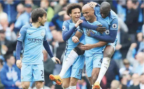  ??  ?? Manchester City's Vincent Kompany (4) celebrates scoring his side's second goal of the game during the Premier League match against Crystal Palace at The Etihad Stadium, Manchester, England. Saturday May 6, 2017 Photo: AP