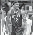  ?? JAMIE SQUIRE/GETTY-AFP ?? Jared Butler scored 22 points as No. 4 Baylor won at No. 3 Kansas on Saturday.