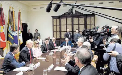  ?? AP/EVAN VUCCI ?? President Donald Trump holds a meeting Friday in the White House with members of the National Associatio­n of Manufactur­ers. “We’re bringing manufactur­ing and jobs back to our country,” he later said about executive orders that target the nation’s trade...