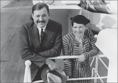  ??  ?? Ernest Hemingway and his wife, Pauline Pfeiffer, arrive in New York aboard the ocean liner Paris on April 3, 1934, after a three-month vacation in eastern Africa hunting lions. Pauline’s uncle, Gus Pfeiffer, paid for the safari, which inspired the book “Green Hills of Africa” and several short stories, including “The Snows of Kilimanjar­o.”
(AP file photo)