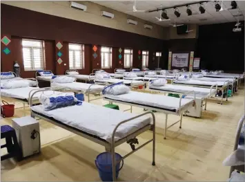  ?? BLOOMBERG ?? Lines of beds at a makeshift Covid-19 quarantine facility set up at the Sarvodya Bal Vidalya Rose Avenue school in New Delhi, India, which reported a record one-day jump of infections recently