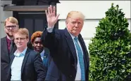  ?? SUSAN WALSH/AP PHOTO ?? President Donald Trump waves after meeting with the 2018 White House Correspond­ents’ Associatio­n Scholarshi­p Winners on the South Portico of the White House in Washington on Friday.