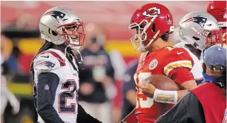  ?? CHARLIE RIEDEL THE ASSOCIATED PRESS FILE PHOTO ?? New England Patriots cornerback Stephon Gilmore, left, talks with Chiefs quarterbac­k Patrick Mahomes after their game Monday night in Kansas City. On Wednesday, the New England defensive back reportedly tested positive for COVID-19.