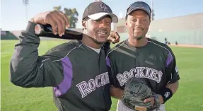  ?? BARBARA JEAN GERMANO ?? Charles Johnson, right, with teammate Preston Wilson in 2003, was the last everyday African-American catcher in the major leagues.