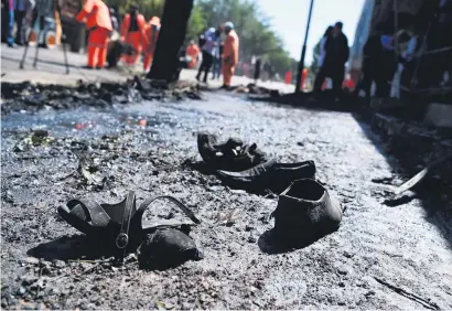  ?? Picture: AFP ?? CHARRED. The footwear of victims of a bus bomb attack in western Kabul yesterday.