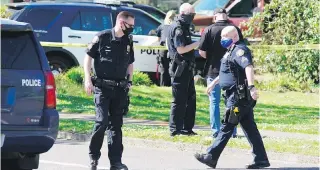  ?? THE OREGONIAN VIA AP ?? Police work at the scene after a man was shot at Lents Park, in Portland, Oregon. Police fatally shot a man in the city park on Friday after responding to reports of a person with a gun.