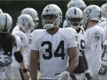  ?? Jeff Chiu ?? Chris Warren is battling to be the Raiders’ No. 4 running back. His main competitio­n is Deandre Washington, whois recovering from arthroscop­ic knee surgery.The Associated Press