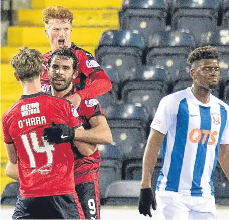  ??  ?? Simon Murray and Mark O’hara congratula­te Sofien Moussa after his penalty equaliser for Neil Mccann’s side.