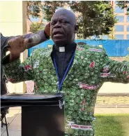  ?? ?? The Rev. Jerry Kulah, of Liberia, leads a prayer Thursdayou­tside the Charlotte Convention Center, in Charlotte, N.C., at a gathering of African delegates where he decried a vote by the General Conference of the United Methodist Church that replaced its definition of marriage with one that doesn’t limit marriage to a heterosexu­al couple. He said the denominati­on is contradict­ing the Bible’s teaching. (AP Photo/Peter Smith)