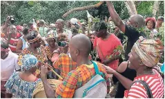  ??  ?? The procession returning from the peace cave after ‘feeding’ the ancestors at the January 6 celebratio­ns in Accompong Town, St Elizabeth.