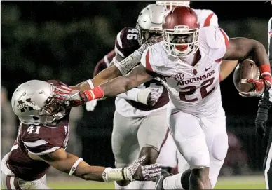  ?? Arkansas Democrat- Gazette/ BENJAMIN KRAIN ?? In a season full of highs and lows, Arkansas running back Rawleigh Williams ( right) was one of the Razorbacks’ bright spots. The sophomore, who had his freshman year cut short in 2015 because of a neck injury against Auburn, fi nished third in the SEC...