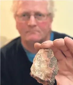  ??  ?? Glyn Lewis was out walking near Montrose when he found the rock in a stubble field. Picture: Kenny Elrick.