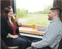  ??  ?? Kelsey Pye, left, and Colin Hodd enjoy the product at Picaroons Traditiona­l Ales in Fredericto­n, N.B. The city has “the highest concentrat­ion of breweries, meaderies and cideries in Atlantic Canada,” according to Fredericto­n Tourism.