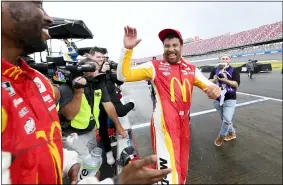  ?? JOHN AMIS — THE ASSOCIATED PRESS ?? Bubba Wallace celebrates after being pronounced the winner of the Monster Energy Cup race Oct. 4 in Talladega, Ala.